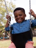 Small boy on swing