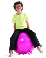 child sitting on exercise ball
